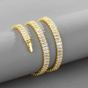Gold plated tennis bracelet with baguette-cut cubic zirconia and safety clasp closure