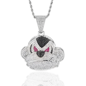 Macro detail of iced out hip hop monkey pendant with sparkling rhinestones on rope chain