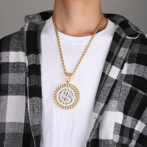Macro detail of rotating hip-hop dollar sign pendant with sparkling diamonds and rope chain
