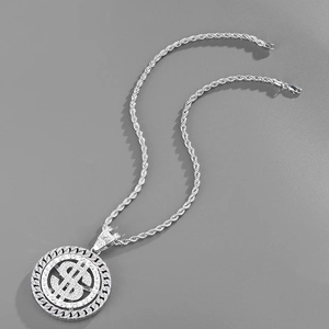 Detailed macro view of iced-out silver dollar sign pendant with Cuban link border