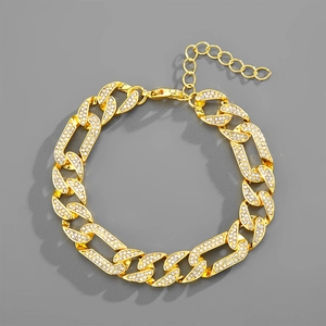 Detail of gold Cuban link bracelet with iced out pavé rhinestones and lobster clasp