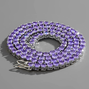 Macro shot of purple tennis necklace featuring round-cut zircons in silver prong setting