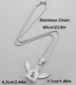 Macro detail of iced out money bag pendant with green dollar sign on stainless steel chain
