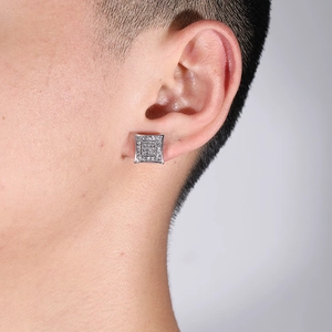 Square micro-pave silver stud earrings with sparkling cubic zirconia on a female model