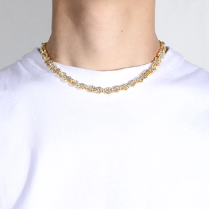 Close-up of gold plated Cuban chain with infinity links and micro-pave zircons
