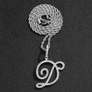 Macro shot of a silver hip hop letter D pendant with micro-pave stones on rope chain