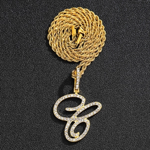 Hip hop gold twist rope chain necklace featuring a large iced-out cursive letter G pendant