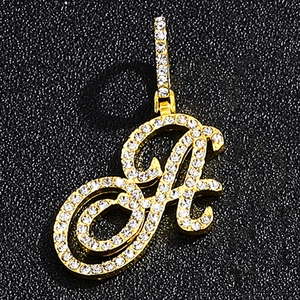Macro shot of hip-hop letter A pendant with gold plating and sparkling zircons