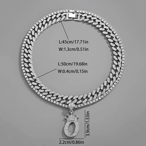 Detailed view of silver Cuban chain set with iced out crown letter O pendant dimensions