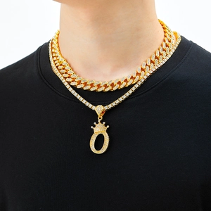 Hiphop gold Cuban and tennis chain set with iced out crown letter O pendant on male model