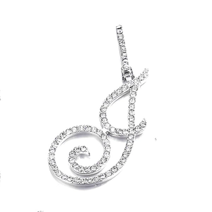 Close-up of cursive letter J pendant with micro-paved zircons on silver cuban chain