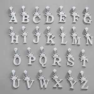 Close-up of 26 icy silver crown capital letter pendants with iced out pave zircon stones
