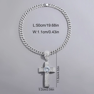 Detail showing oversized cross pendant with skull design and large central rhinestone