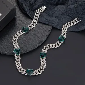 Close-up of diamond Cuban link necklace with emerald green hearts and size dimensions