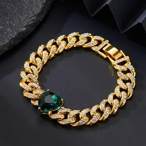 Detailed view of Cuban link chain with green heart gemstone and white zircon setting
