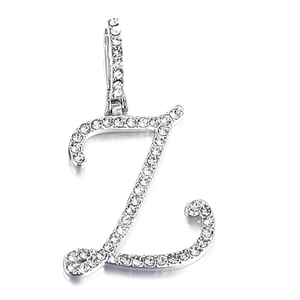 Macro detail of silver letter Z pendant encrusted with white sparkling rhinestones