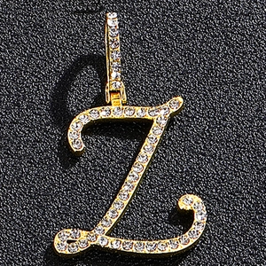 Macro shot of gold-plated letter Z pendant with iced out rhinestones and diamond-set bail