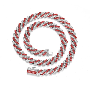 Detail of red and white rhinestones on silver Cuban link chain with a square clasp