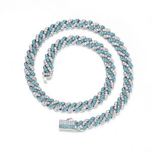 Detail of 9mm two-tone Cuban link chain with blue and white crystals in hip hop style