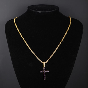 Detail of hip hop rope chain with cross pendant paved in purple round cut zircons