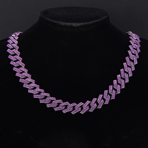 Detail of hip hop Cuban chain with purple rhinestones on black display neck model