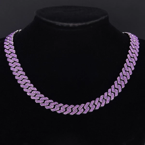 Close-up of purple Cuban link necklace with rhinestones displayed on a black neck model