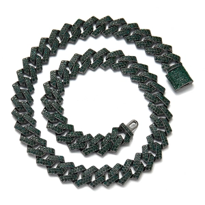 Detail of green rhinestone Cuban link chain with high-gloss gunmetal finish in a swirl layout