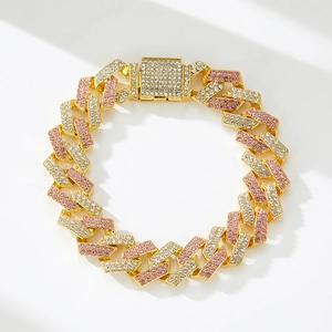 Detail of gold Cuban link bracelet with pavé pink and white crystals and square clasp
