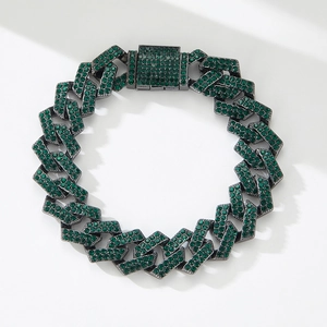 Detail of hiphop cuban link bracelet with green rhinestones on gunmetal finish
