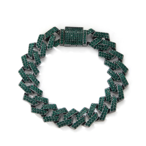 Detail of hip hop Cuban link necklace with green rhinestones on black plating finish