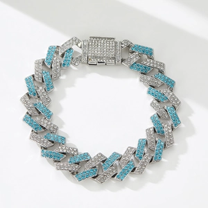 Detail of silver Cuban link chain with blue and white crystals and square buckle clasp