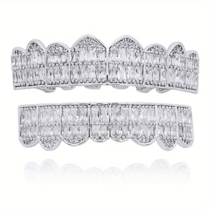 Macro view of silver hip hop grillz set with rectangular iced out cubic zirconia stones