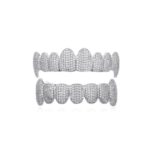 Macro shot of silver hip-hop grillz with pavé-set zircons on high-quality metal plating