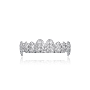 Macro detail of silver-toned 8-tooth hip hop grillz with shimmering pavé zircon stones