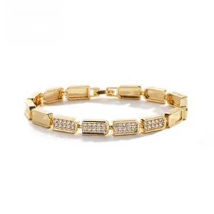 Detailed macro view of 18k gold plated Cuban link bracelet with micro-paved cubic zirconia