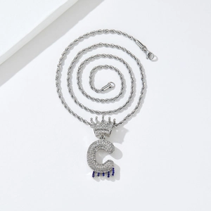 Close-up of hip hop crown letter C pendant with silver twisted rope chain necklace