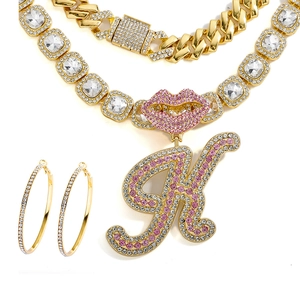 Hip hop jewelry set featuring gold Cuban chain, crystal letter K pendant and hoop earrings