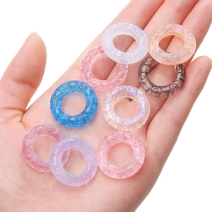 Close-up of 25mm patterned resin rings for DIY jewelry making in various colors