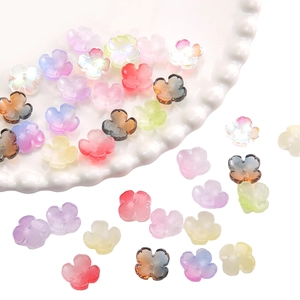 Macro shot of colorful translucent glass flower beads with iridescent AB coating for DIY crafts