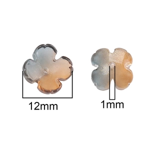 Detail of 12mm clover glass beads with blue-brown gradient and gold glitter for DIY jewelry