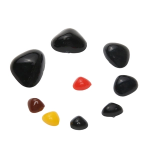 Detailed view of colorful glossy acrylic triangular noses for handmade DIY stuffed toys