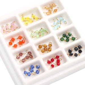 Detailed view of 4mm faceted glass crystal pendants in 12 colors for DIY jewelry making
