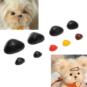 Close-up of assorted acrylic triangular noses for handmade DIY plush toys and dolls