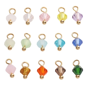 Macro view of colorful 4mm faceted glass bead charms with gold loops for DIY jewelry