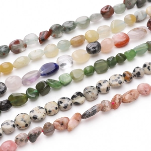 Detailed view of polished natural irregular stone beads for DIY jewelry making