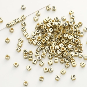 Golden acrylic alphabet cube beads for DIY jewelry making with HAPPY message