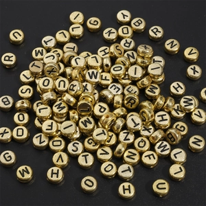 Flat round gold acrylic alphabet beads with black letters for DIY jewelry making
