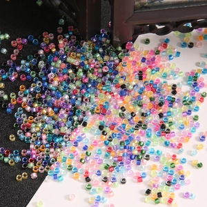Close-up of assorted colorful silver-lined glass seed beads for DIY jewelry making