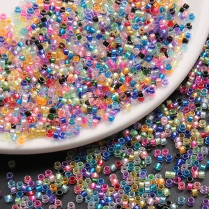 Macro shot of assorted colorful glass seed beads for DIY jewelry and crafts making
