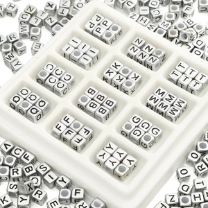 Close-up of silver square acrylic alphabet beads for DIY jewelry and bracelets